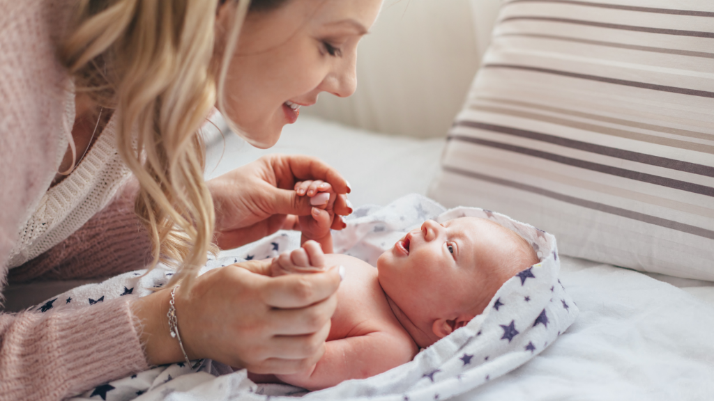 the happy moment of mother with baby