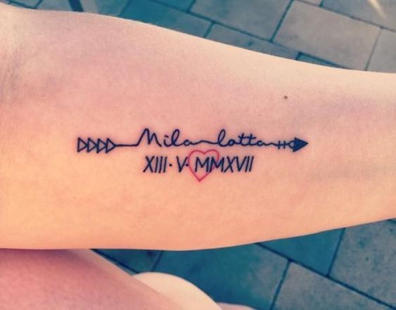Arrow with baby name tattoo